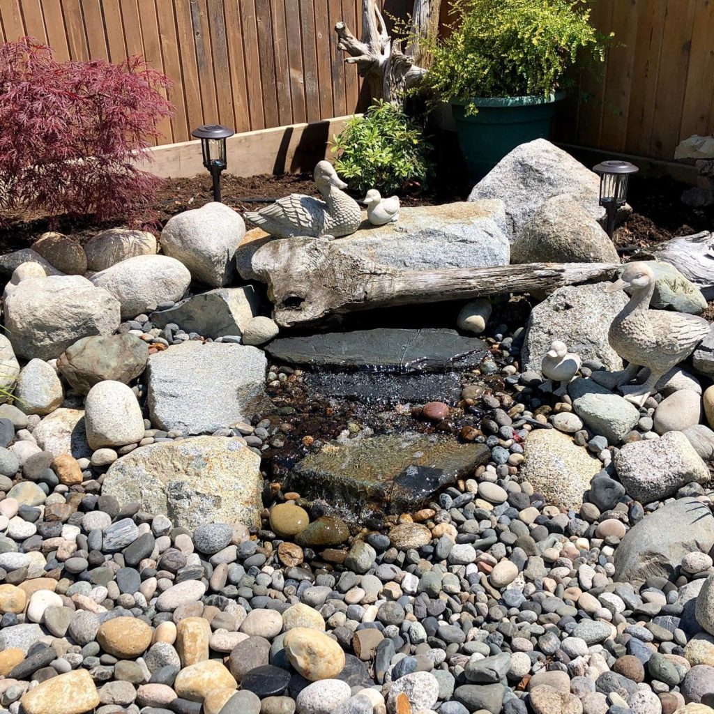 Landscape contractor water feature installation